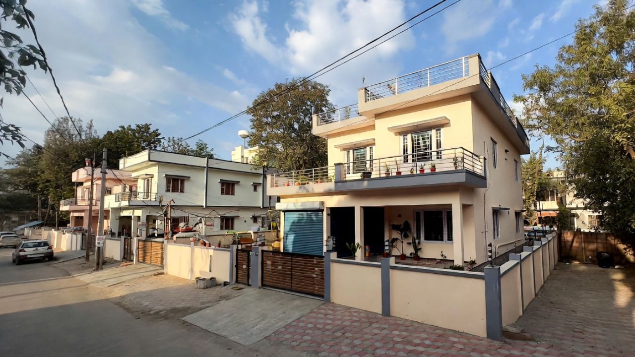 2BHK corner house for sale in Rudrapur with balcony, parking, and modern exterior